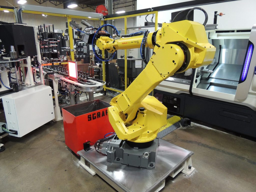  Yellow robotic arm showing an example of robotic part handling