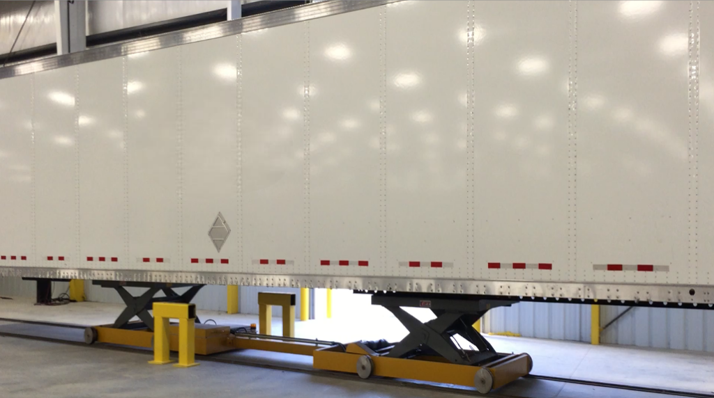 Image of a truck and trailer assembled from new spare parts
